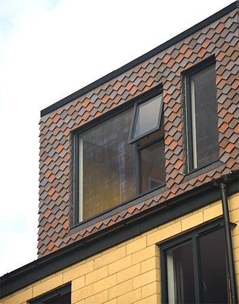 Loft extension with Dreadnought handmade arrowhead tiles